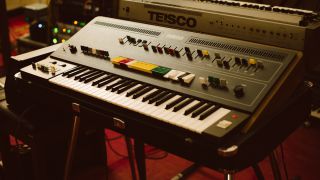 A Synth Orchestra in a recording studio with a tesco synthesizer.