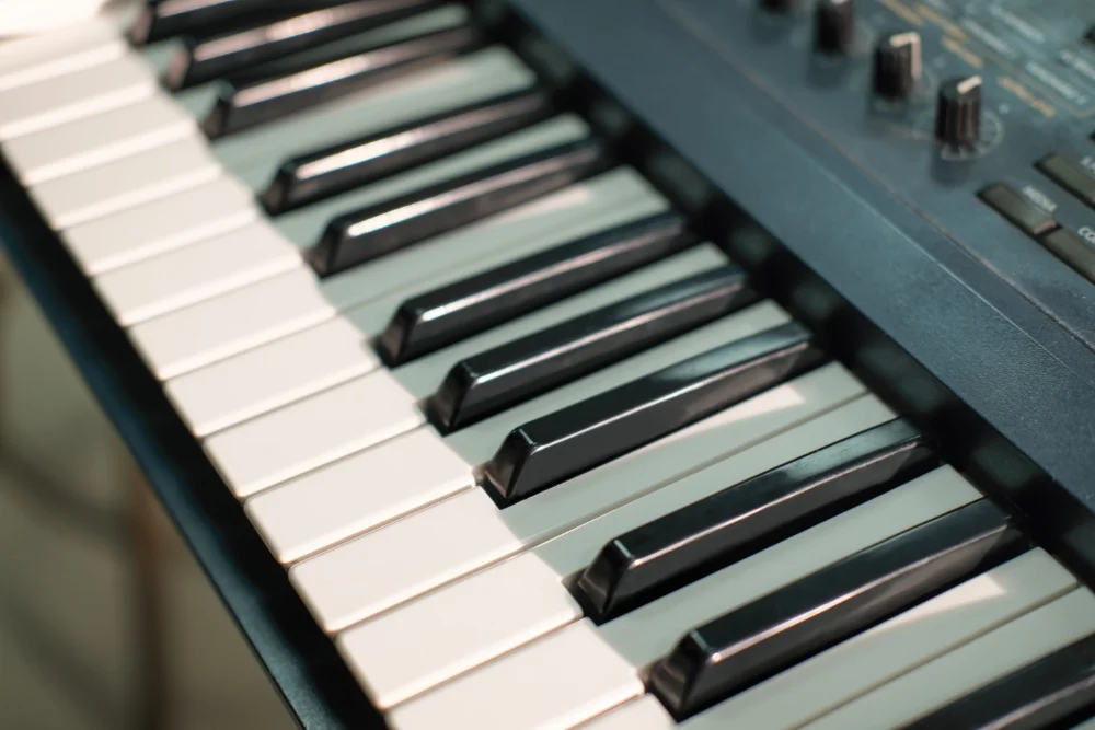 A close up of an electronic keyboard with EQ-ing capabilities.