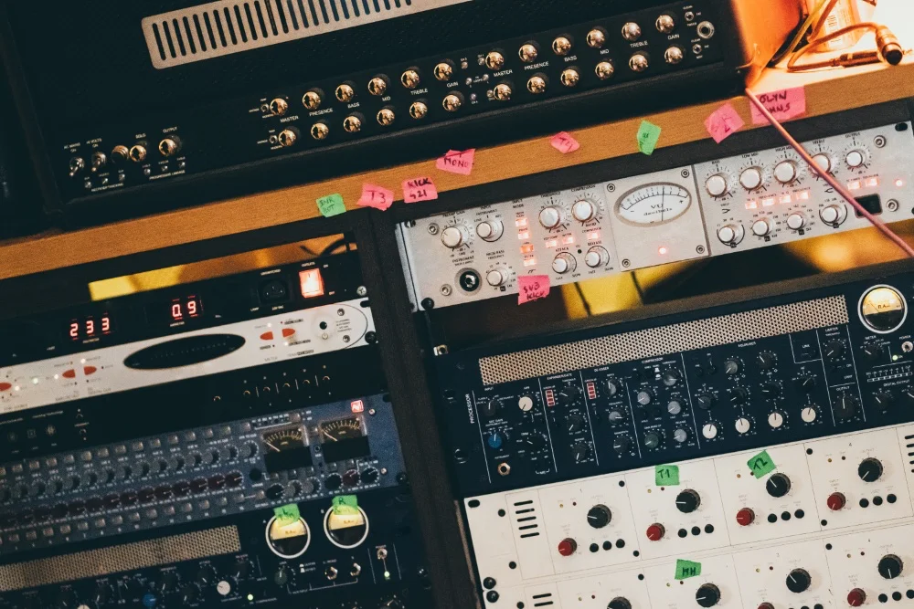 Many different types of equipment in a recording studio for perfect sound.