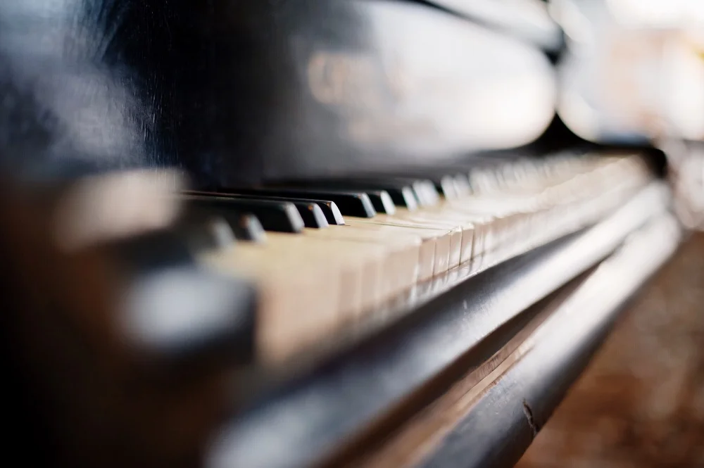 A close up of a black piano with perfect sound.
