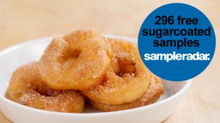A bowl of sugar-coated donuts with 25 free samples.