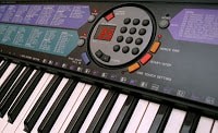 A close up of a Yamaha electronic keyboard.